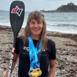 Paddleboarder triumphs with world titles after cancer diagnosis
